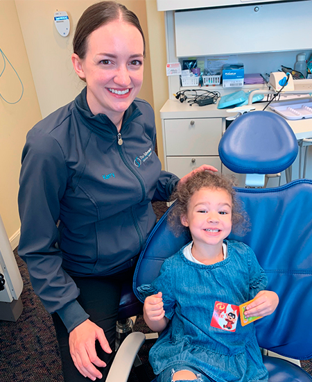 One of our dental assistants with a little girl in Silberman's office